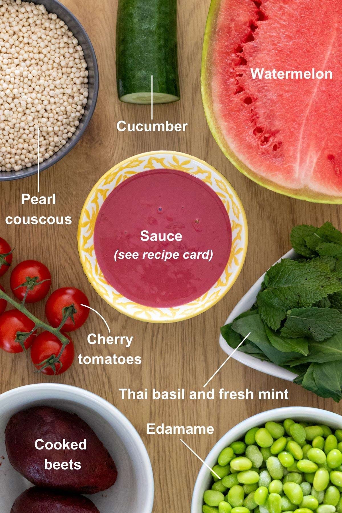 Ingredients for the summer watermelon and beet salad on a wooden table.