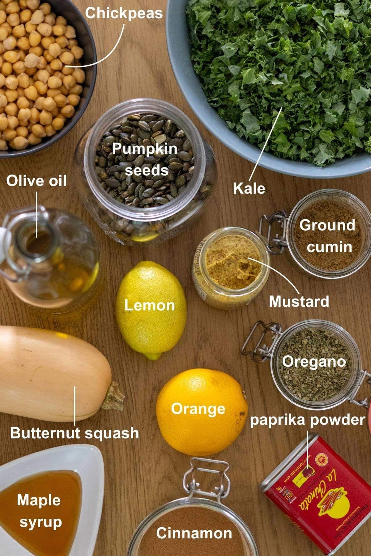 The ingredients for the Easy Kale and Chickpea Salad on a wooden table.