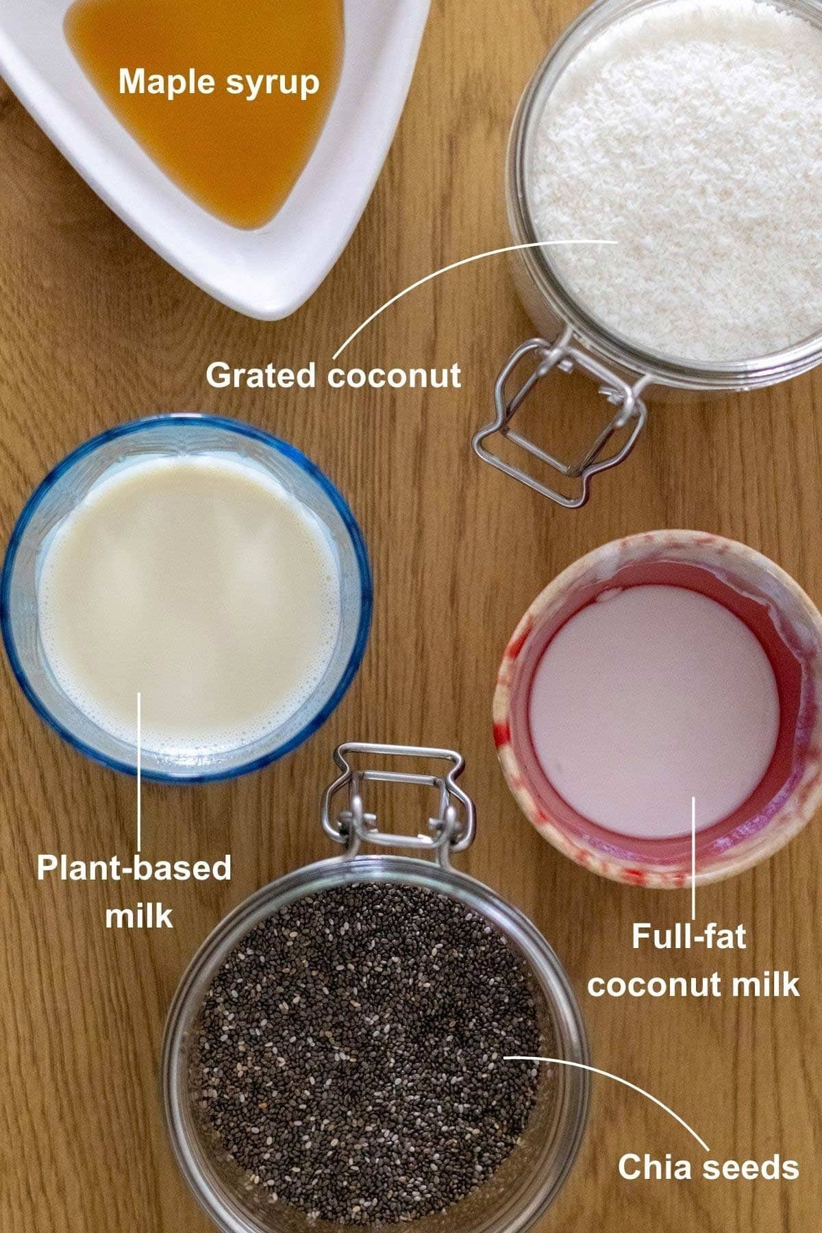 The ingredients for the Creamy Coconut Chia Pudding recipe on a wooden table.